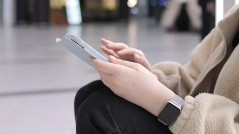 Close-up of person holding and using digital tablet in indoor setting Stock Footage 340939470