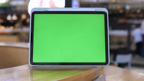 Close-up of person holding and using digital tablet in indoor setting Stock Footage 341482034