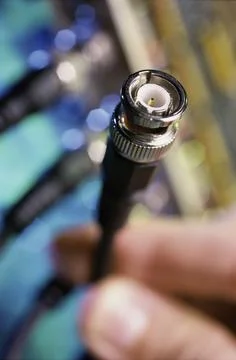 Close up of a person holding a computer cable Stock Photos