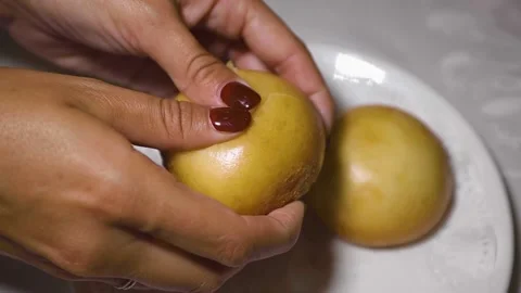 A close up of a person holding a doughnut Stock Footage 155453705