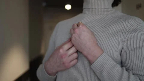 A close-up of a person holding their hands over the thymus area, suggesting disc Stock Footage 291848769