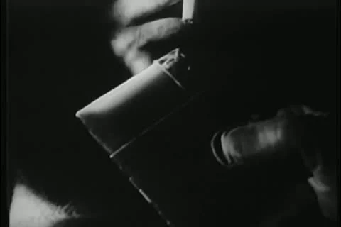 Close-up of person igniting cigarette with lighter Stock Footage 25195597