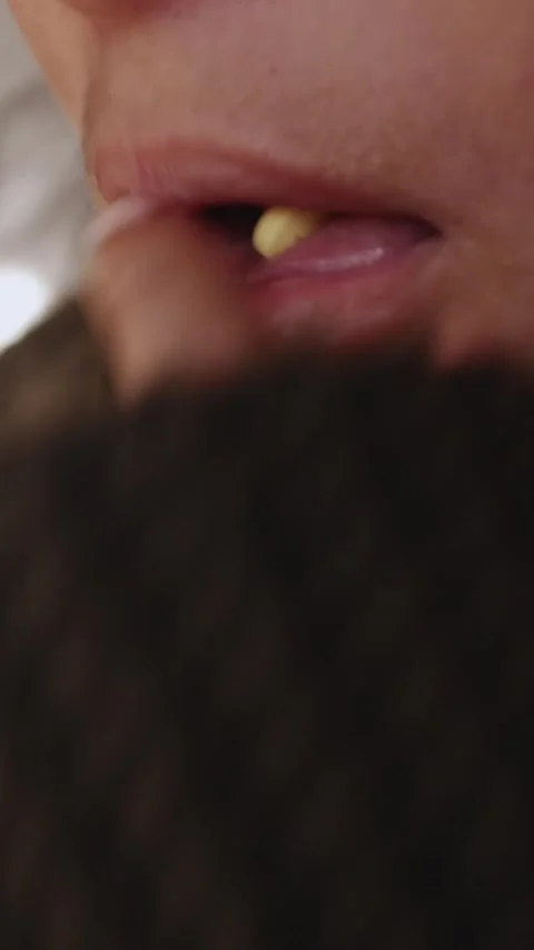 Close-up of person inserting pill mouth Stock Footage 314912799