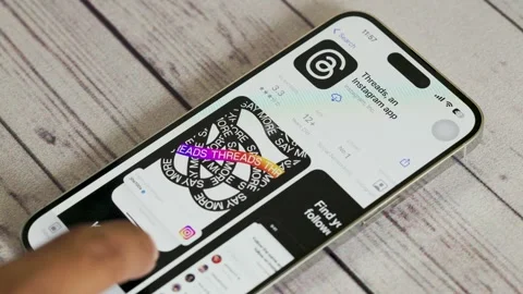 Close-up of a person installing Threads app on a Smartphone. Stock Footage 245504642