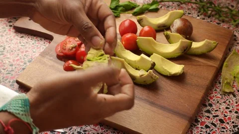Close up of person making healthy vegan meal at home -25s Stock Footage 128715476