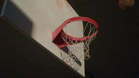 Close-up of Person Making a Scoring Basket on Outdoor Basketball Hoop at Sunset Видео 270398316