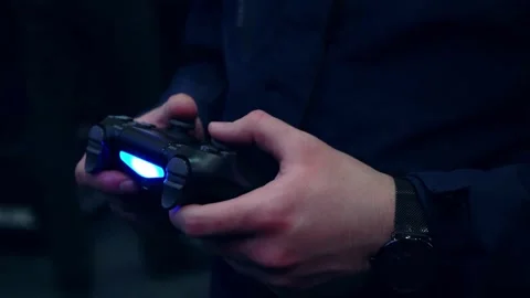 Close-up of an person man hand with the joystick of a gaming console. free time Stock-Footage 334653231
