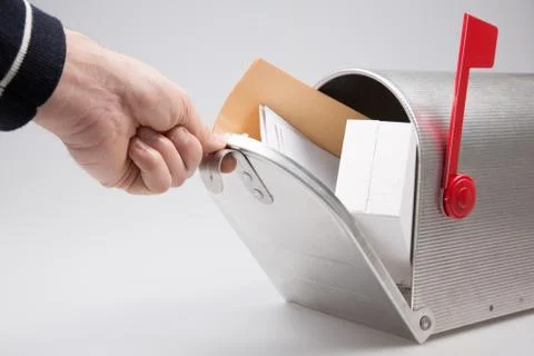 Close-up Of Person open box mail Stack Of Letters and package parcel In Mailb 库存照片