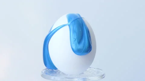 Close-up of a person painting Easter eggs with a special brush Stock Footage 172190727