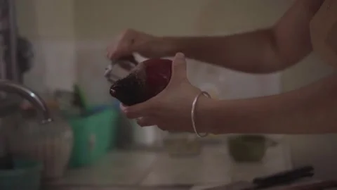 Close up of a person peeling a beetroot in a kitchen Video stock 341892009