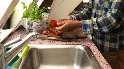 Close up person preparing fresh and organic veggies at home-15s Stock Footage 128931365