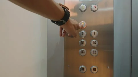 Close up of a person pressing a button in an elevator. 库存影片 343416010