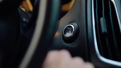 Close-up of Person Pressing a Start Engine Button with a Finger. Stock Footage 253074318