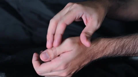 Close Up of Person Pressing Thumb Joint Showing Hand Pain or Discomfort 库存影片 337785100