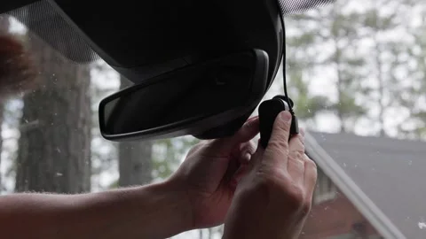 Close-up of a person removing a memory card from a dash camera. Horizontal. Stock Footage 341361322