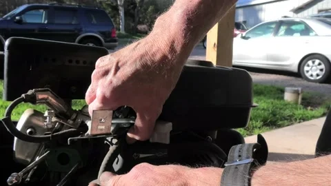 A Close Up of a Person Removing a Small Engine Gas Tank. Stock Footage 199719331