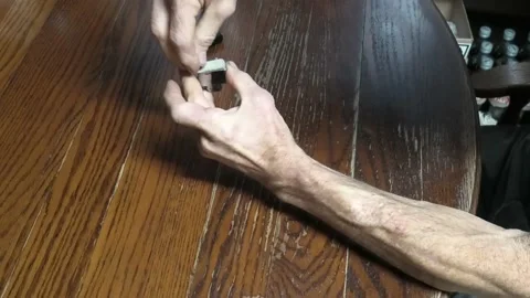 A Close Up of a Person Replacing a Lighter Flint and the Lighter Still Fails Stock-Footage 154553157