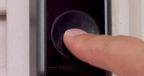 A close up of a person ringing an Eufy Video Doorbell Wired S330. Smart doorbell Video stock 248807357