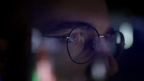 Close Up Of Person With Round Glasses Looking At Computer Screen Digital Life Stock Footage 297322106