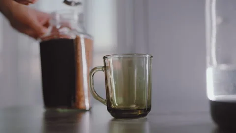 Close Up Of Person Scooping Coffee With Spoon Into Empty Mug Stock Footage 321428270