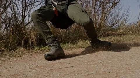 Close-up of person sliding on dirt while paragliding at Zoutelande Stock Footage 303545931