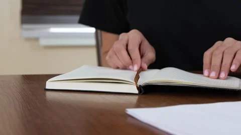 Close-up of a person starting their workday, opening a laptop at a home office Stock Footage 323172256