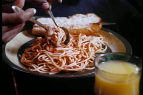 Close-up of person twirling spaghetti on fork Stock Footage 11365724