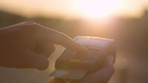 CLOSE UP: Person types their passcode on card reader keyboard on sunny evening Video stock 140541479