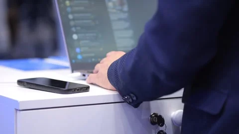 Close-up of person typing on laptop at tech event Stock Footage 344685267