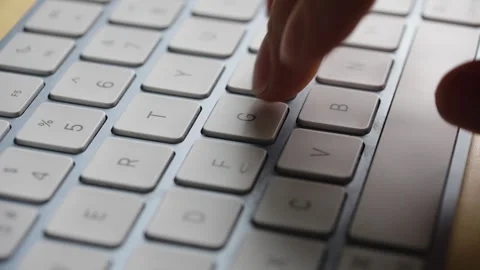 Close Up Of Person Typing With One Hand On Modern Keyboard Stock Footage 328583949