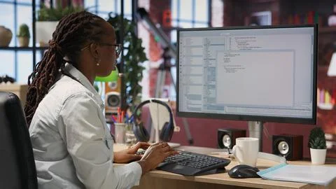 Close up of person using coding application to write and test code Stock Photos