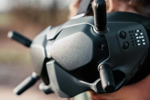 Close up of a person using the fpv goggles for a dji drone 写真素材