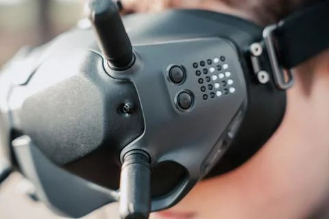 Close up of a person using the fpv goggles for a dji drone 写真素材