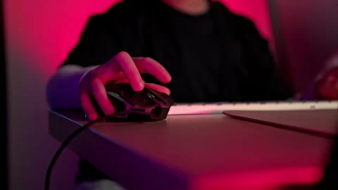 Close-up of a person using a gaming mouse with RGB lighting Video stock 317876485