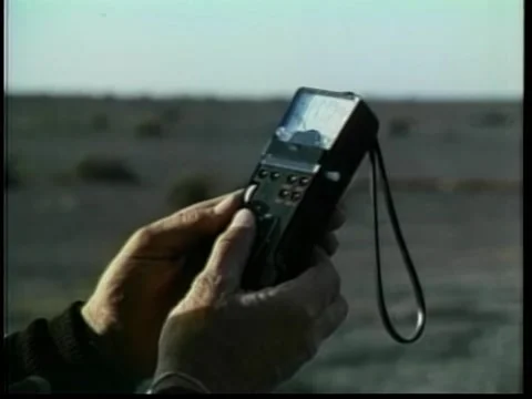 Close-up of person using Geiger counter, 1970s Stock-Footage 260258435