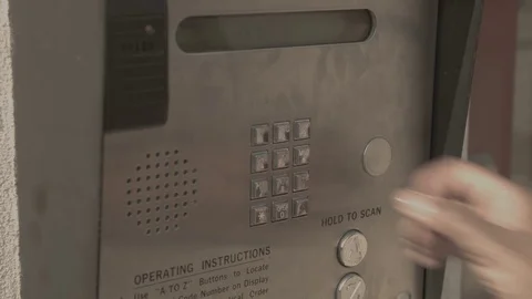Close-Up Of Person Using Intercom Stock Footage 76803342