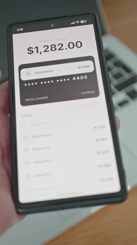 Close up of person using mobile banking app showing card blocked Stock Footage 335542385
