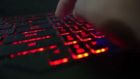 Close up of a person using a numeric keypad on a laptop computer with glowi.. Stock Footage 340490360