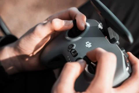 Close up of a person using a remote control for a dji drone 写真素材