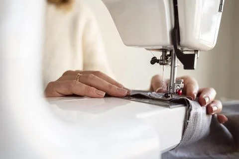 Close up person using sewing machine Resolution and high quality beautiful photo Stock Photos