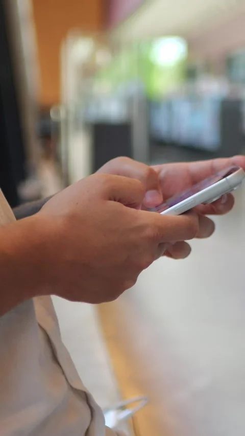 Close-Up of Person Using Smartphone in Library, Mobile Communication... Stock Footage 344455207