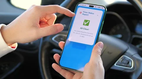 Close-up of a person using a smartphone to verify fines. Stock-Footage 327319738