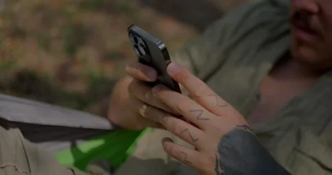 Close-Up Of A Person Using A Smartphone While Relaxing... Stock Footage 331820735