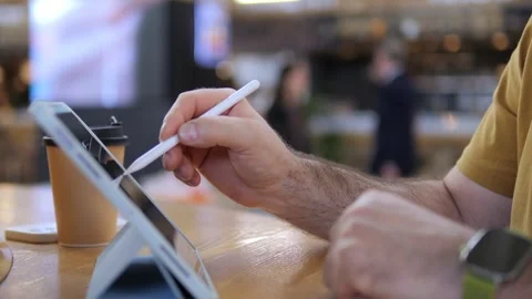 Close-up of person using stylus on tablet Stock Footage 341486231