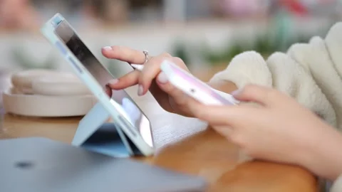 Close-up of person using tablet and laptop Stock Footage 345926433