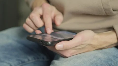 Close up of a person using a touchscreen tablet device, focusing on hands and Stock Footage 341032505