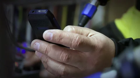 Close Up Of Person Using Vintage Mobile Telephone Inside Recording Booth - 4K Stock Footage 337646638