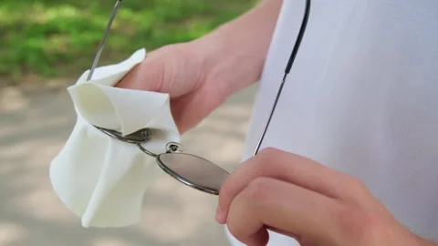 Close up of a person using a white microfiber cleaning cloth to wipe and cl.. Stock Footage 339527728