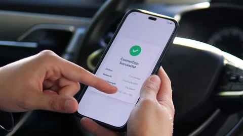 Close-up of a person verifying a stable internet connection from their vehicle Video stock 315561077