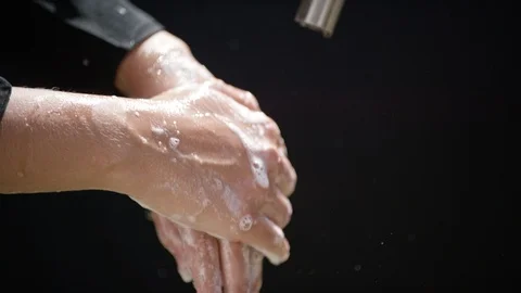 Close-up of person washing hands with soap and water Stock Footage 127026331